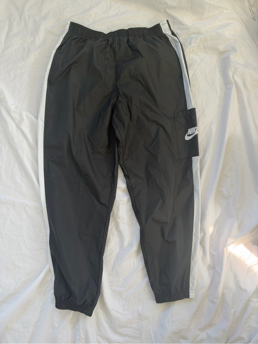 Nike Kids' Black Track Pants with White Side Stripes